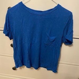 Royal blue slightly cropped tee shirt.
